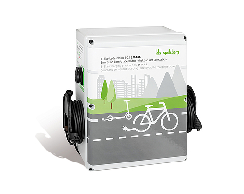 Spelsberg BCS charging station compatible with Shimano, Bosch, and standard 13-amp connections. enabling a single BCS unit to cover multiple e-bike charging systems.